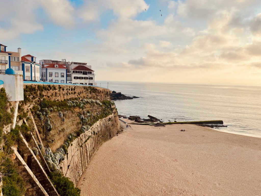 view to the ocean a part of town with little Portuguese houses in Ericeira in Portugal